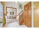 Welcoming entryway with tiled floors, staircase, and doorway leading to a bright living area at 6210 Mckinley Ct, Indianapolis, IN 46220