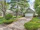 Charming home with a well-manicured lawn, mature landscaping, and a convenient two-car garage at 6210 Mckinley Ct, Indianapolis, IN 46220