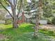 Charming home with a well-manicured front yard, mature trees, and a classic architectural style at 6210 Mckinley Ct, Indianapolis, IN 46220