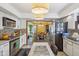 Open kitchen layout with stainless steel appliances, view to dining area, and adjacent island at 6210 Mckinley Ct, Indianapolis, IN 46220