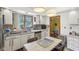 Functional kitchen featuring stainless steel appliances, white cabinetry, and ample countertop space at 6210 Mckinley Ct, Indianapolis, IN 46220