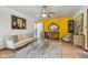 Bright living room with yellow accent wall, a modern glass coffee table, and cozy seating at 6210 Mckinley Ct, Indianapolis, IN 46220