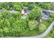 Aerial view of the home showcasing the pool, deck, and surrounding lush greenery and neighborhood at 6530 Lowanna Way, Indianapolis, IN 46220