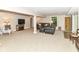 Spacious basement with comfortable seating, TV area, neutral carpeting, and an egress window at 6530 Lowanna Way, Indianapolis, IN 46220