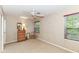 Bedroom with light-colored walls, ceiling fan and dresser at 6530 Lowanna Way, Indianapolis, IN 46220
