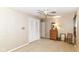 Bedroom with light-colored walls, ceiling fan and dresser at 6530 Lowanna Way, Indianapolis, IN 46220