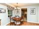 Eat in kitchen with wood floors, breakfast table, and charming decor at 6530 Lowanna Way, Indianapolis, IN 46220