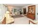 Comfortable living room with neutral paint, plush seating, and bright, natural light at 6530 Lowanna Way, Indianapolis, IN 46220
