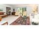 Classic living room with large windows, traditional furnishings and a patterned area rug at 6530 Lowanna Way, Indianapolis, IN 46220