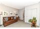 Cozy living area with couch, storage, and carpet flooring at 6530 Lowanna Way, Indianapolis, IN 46220