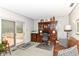 Office space with built-in desk, wood accents, and walk-out to the deck at 6530 Lowanna Way, Indianapolis, IN 46220
