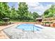 Inviting in-ground pool with patio surround and wooden deck, perfect for outdoor relaxation and entertainment at 6530 Lowanna Way, Indianapolis, IN 46220