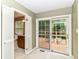 Cozy sitting room with entry to the ensuite bathroom and sliding doors out to the deck at 6530 Lowanna Way, Indianapolis, IN 46220