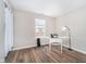 Bedroom featuring a sewing machine table and wood-look floors at 6789 Passage Cir, Indianapolis, IN 46250