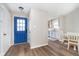 Bright foyer with light wood floors and a view into the kitchen at 6789 Passage Cir, Indianapolis, IN 46250