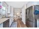 Kitchen with stainless steel appliances and eat-in area open to living room at 6789 Passage Cir, Indianapolis, IN 46250