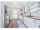 Bright kitchen with stainless steel appliances, butcher block counters, and tile backsplash at 6789 Passage Cir, Indianapolis, IN 46250