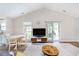 Spacious living room with vaulted ceilings and a cozy dining area at 6789 Passage Cir, Indianapolis, IN 46250