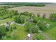 Aerial shot of the property and surrounding area featuring a landscape of green space and trees at 679 Bark Dr, Anderson, IN 46011