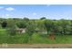 Beautiful aerial view of the house, expansive lawn, and red barn on a sunny day at 679 Bark Dr, Anderson, IN 46011