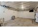 Large unfinished basement with concrete floors, white-painted walls and ceiling, with visible piping at 679 Bark Dr, Anderson, IN 46011