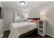 Cozy bedroom featuring a comfortable queen-sized bed, dark wood floors, and neutral walls at 679 Bark Dr, Anderson, IN 46011