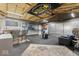 Spacious finished garage featuring plenty of room and a Nascar decoration at 679 Bark Dr, Anderson, IN 46011