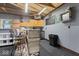 Finished garage with cabinets, countertop, and bar seating provides a versatile and functional space at 679 Bark Dr, Anderson, IN 46011