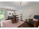 Cozy living room with dark hardwood floors, area rug, and ample space for entertaining at 679 Bark Dr, Anderson, IN 46011