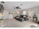 Spacious living room featuring plush seating, ceiling fan, and decorative wall art at 679 Bark Dr, Anderson, IN 46011
