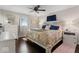 Cozy main bedroom with hardwood floors, ceiling fan, and natural light from the window at 679 Bark Dr, Anderson, IN 46011