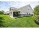 Beautiful backyard with a covered patio and well-maintained lawn, ideal for outdoor activities at 695 Overcup St, Westfield, IN 46074