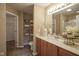 Bathroom with wood cabinets, a large mirror, and a shower at 695 Overcup St, Westfield, IN 46074
