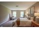 Cozy bedroom featuring carpeted floor, two windows, and decor accents at 695 Overcup St, Westfield, IN 46074
