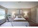 Well-lit bedroom features soft carpet, a window, decorative lamps, and stylish decorations at 695 Overcup St, Westfield, IN 46074