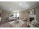 Bright living room with comfortable seating, a fireplace, and a view into the dining and kitchen areas at 695 Overcup St, Westfield, IN 46074