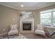 Comfortable living room features a fireplace, neutral tones, and natural light creating a cozy atmosphere at 695 Overcup St, Westfield, IN 46074