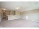 Bright, open living room featuring two windows and carpeted floor at 695 Overcup St, Westfield, IN 46074