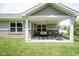 The covered patio is perfect for outdoor relaxation with comfortable seating and views of the lush lawn at 695 Overcup St, Westfield, IN 46074