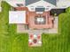 Aerial view of the backyard showing the deck, patio, fire pit, and green lawn at 7022 Tamarind Ct, Indianapolis, IN 46236