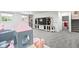 Finished basement featuring an entertainment center, built-in shelves, and play area at 7022 Tamarind Ct, Indianapolis, IN 46236