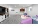 Bright basement with a play area, wet bar, stylish cabinets, and neutral carpeting at 7022 Tamarind Ct, Indianapolis, IN 46236