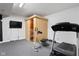 Spacious finished basement featuring exercise equipment, sauna, and carpeting at 7022 Tamarind Ct, Indianapolis, IN 46236