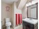 A bathroom with an Indiana Hoosiers theme, sink, and toilet at 7022 Tamarind Ct, Indianapolis, IN 46236