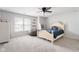 Bright bedroom with a cozy bed, beanbag chair, and ample natural light at 7022 Tamarind Ct, Indianapolis, IN 46236