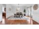 Formal dining room with an oval table, stylish chandelier, and wainscoting details at 7022 Tamarind Ct, Indianapolis, IN 46236