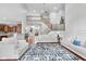 Spacious living room with hardwood floors, staircase, and comfortable seating at 7022 Tamarind Ct, Indianapolis, IN 46236