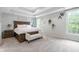 Comfortable main bedroom with tray ceiling, large bed, and ample natural light at 7022 Tamarind Ct, Indianapolis, IN 46236