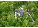 Aerial view of a secluded property surrounded by lush trees and professional landscaping at 7070 Dean Rd, Indianapolis, IN 46220