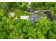 A birds-eye view displays an estate with a pool, basketball court and well-manicured landscape at 7070 Dean Rd, Indianapolis, IN 46220
